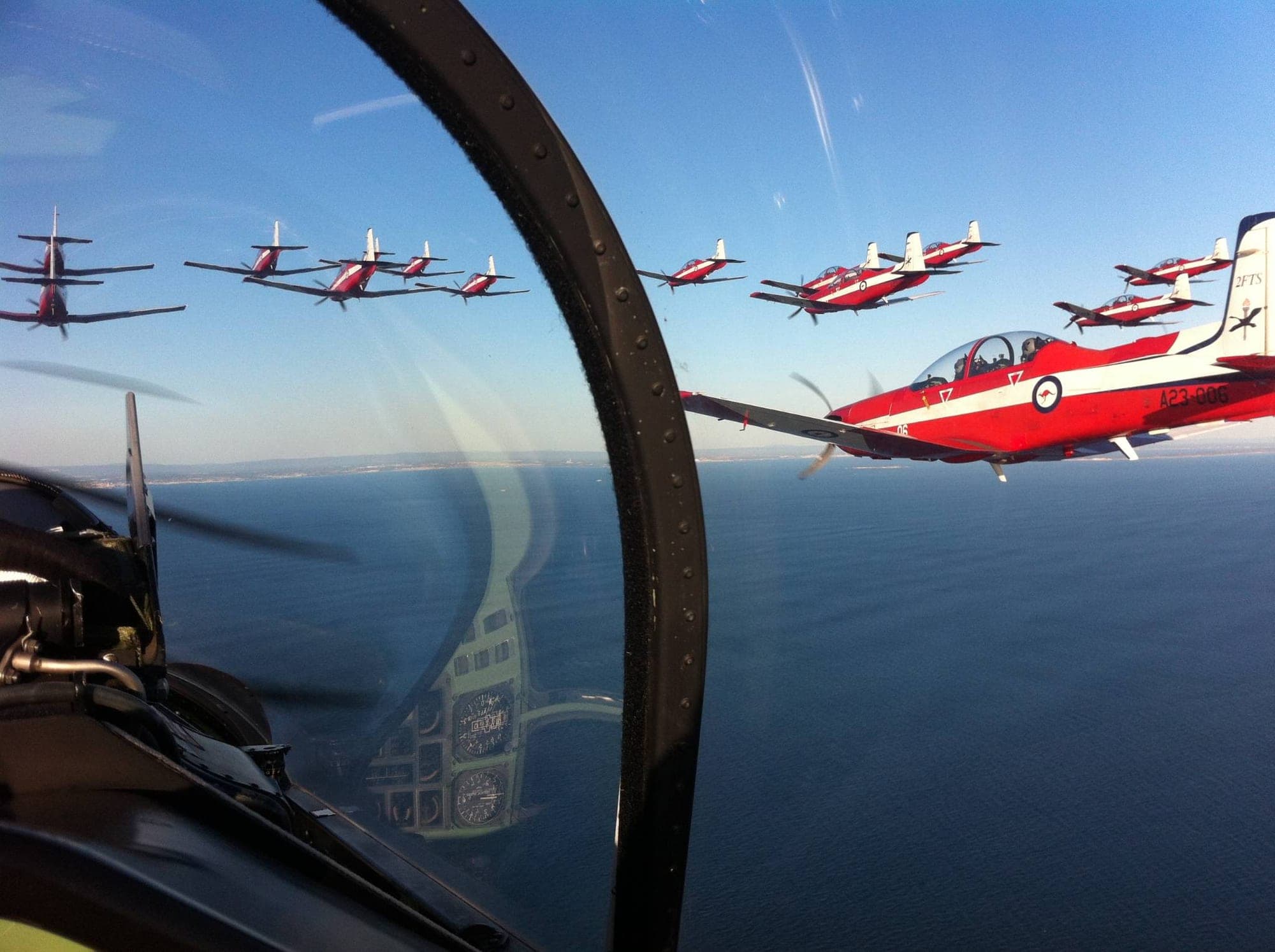 A formation of aircraft holding position, seen from the cockpit